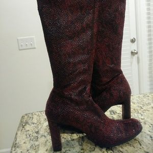 Red snake skin knee high boots